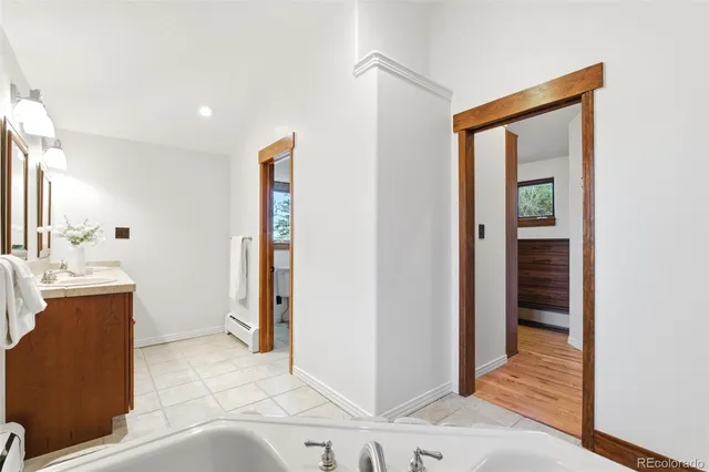 a view of hallway with wooden floor