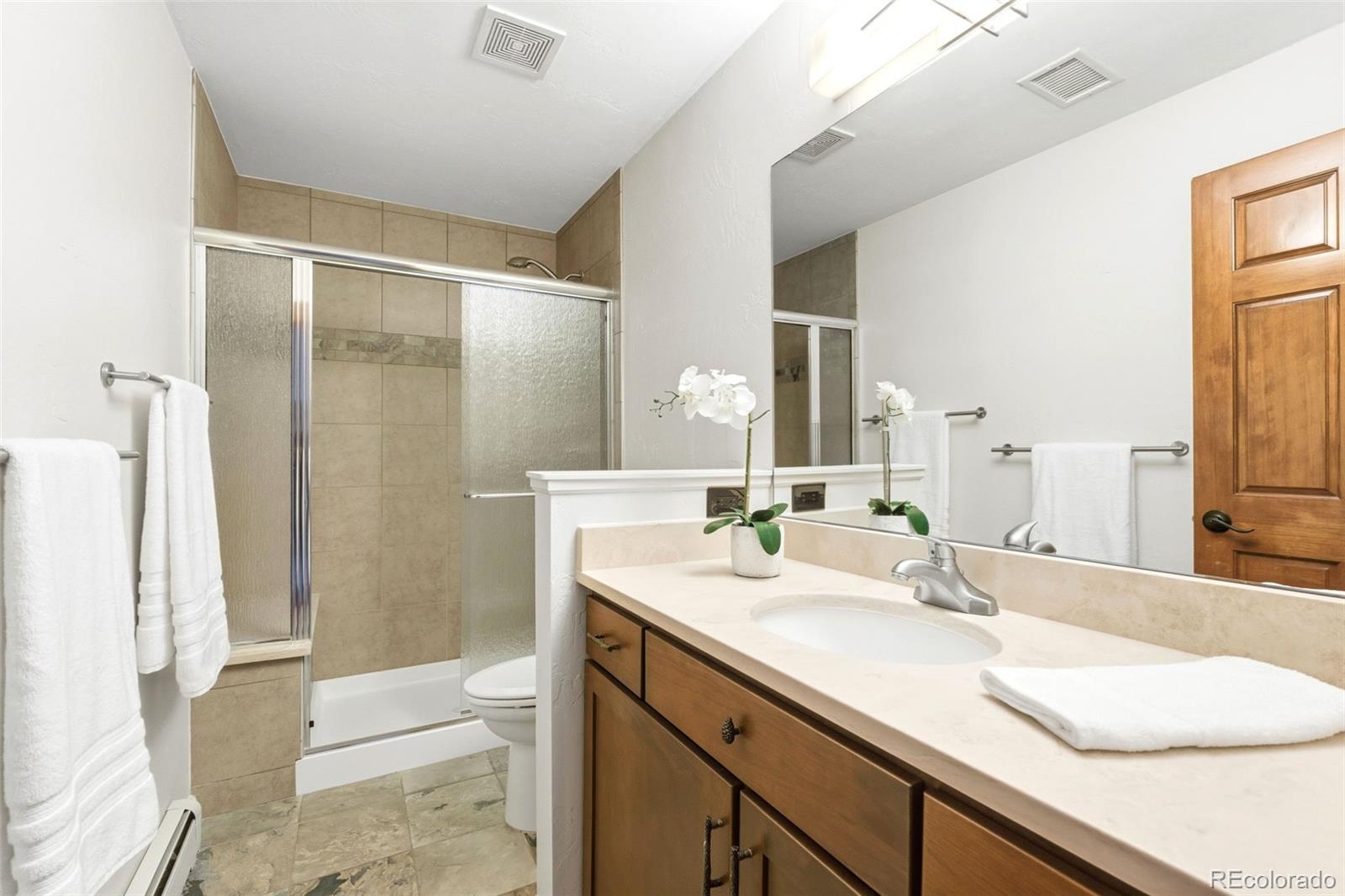 2305 Cherryville Road Greenwood Village, CO 80121 - Photo 29 of 50 a bathroom with a sink and a mirror