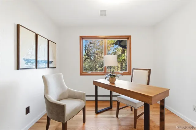 a workspace with furniture and a window