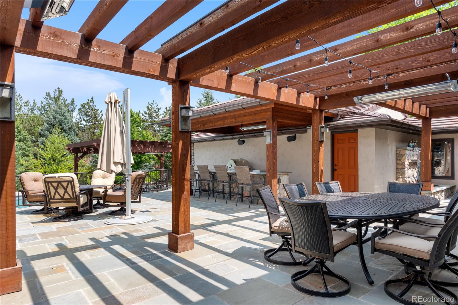 2305 Cherryville Road Greenwood Village, CO 80121 - Photo 35 of 50 a view of a patio with table and chairs and potted plants