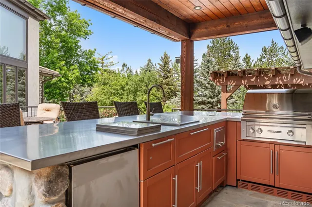 a kitchen with a sink and wooden cabinets