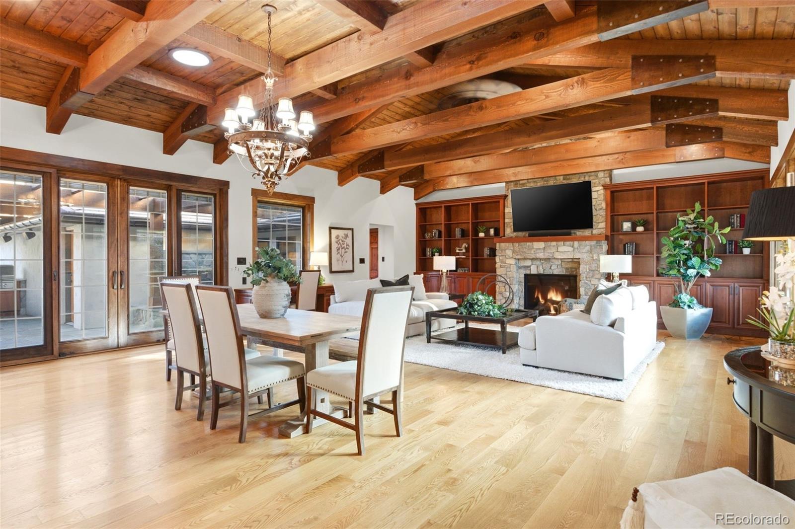 2305 Cherryville Road Greenwood Village, CO 80121 - Photo 4 of 50 a view of a livingroom with furniture a fireplace and wooden floor