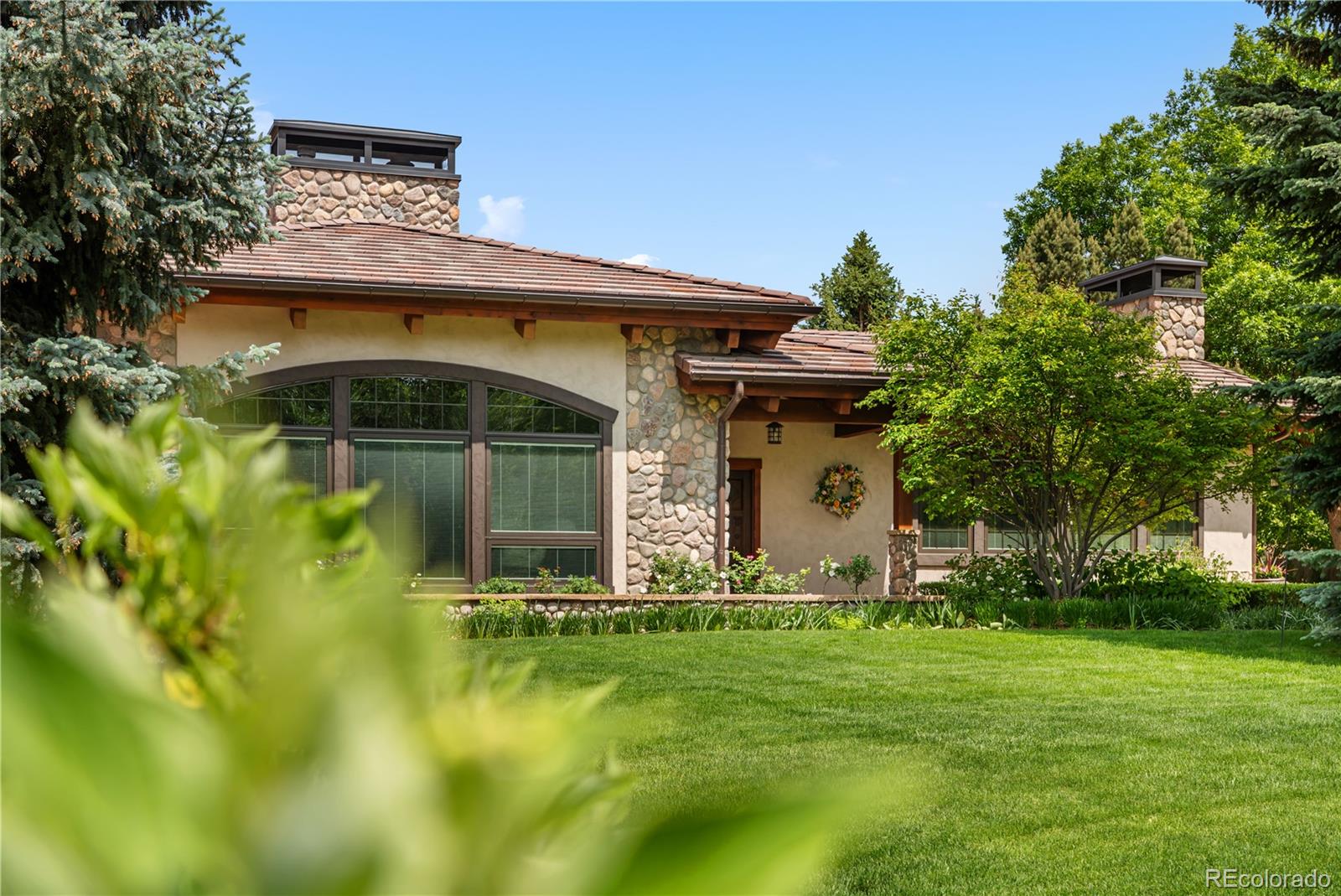 2305 Cherryville Road Greenwood Village, CO 80121 - Photo 45 of 50 a front view of a house with lots of green space