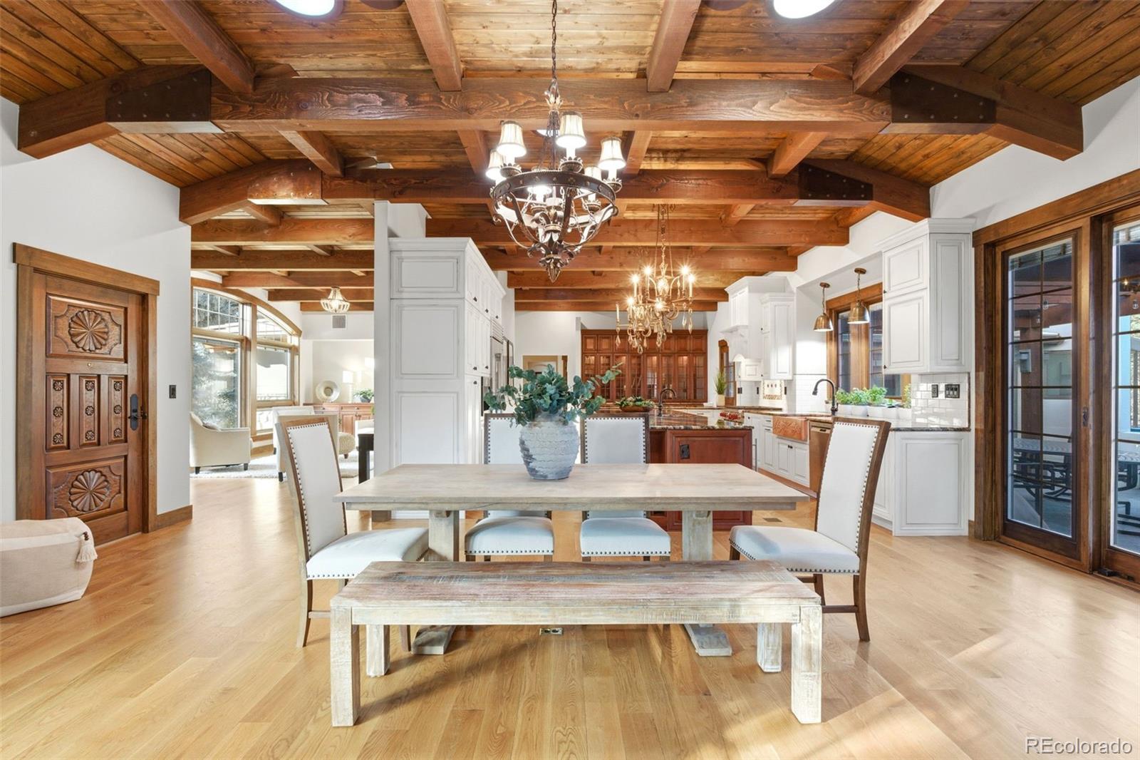 2305 Cherryville Road Greenwood Village, CO 80121 - Photo 10 of 50 a view of a dining room with furniture a chandelier and wooden floor