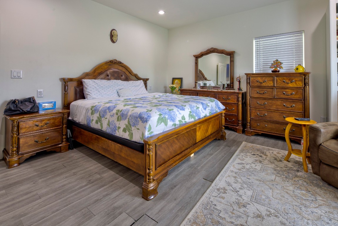 135 Wilbarger Bend Road Bastrop, TX 78602 - Photo 11 of 37 Bedroom featuring recessed lighting and wood finished floors