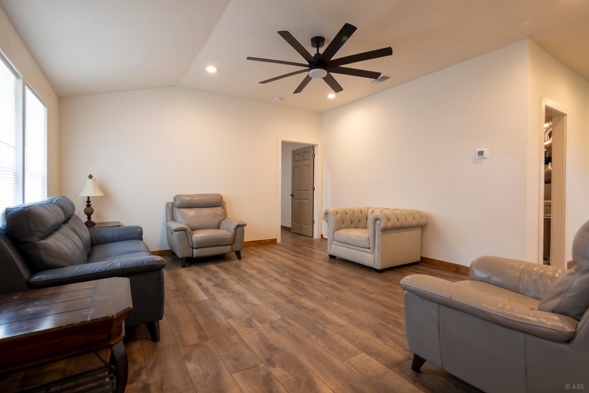 135 Wilbarger Bend Road Bastrop, TX 78602 - Photo 18 of 37 Living area with a ceiling fan, recessed lighting, baseboards, visible vents, and dark wood-type flooring