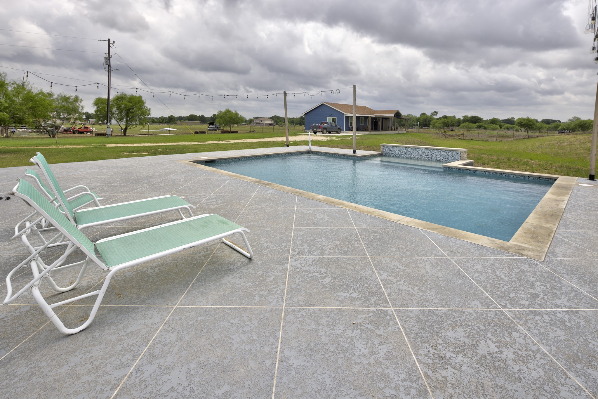 135 Wilbarger Bend Road Bastrop, TX 78602 - Photo 18 of 39 a view of a terrace with lawn chairs