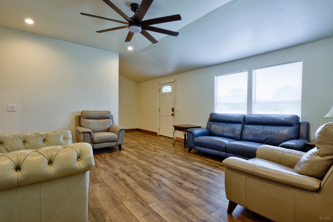 135 Wilbarger Bend Road Bastrop, TX 78602 - Photo 19 of 37 Living area with lofted ceiling, recessed lighting, ceiling fan, and wood finished floors