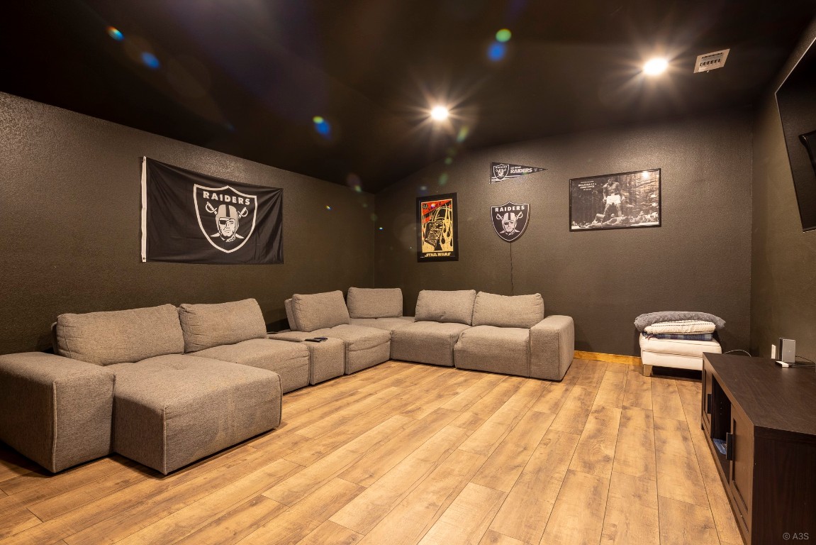 135 Wilbarger Bend Road Bastrop, TX 78602 - Photo 21 of 37 Living area with lofted ceiling, recessed lighting, light wood finished floors, and visible vents
