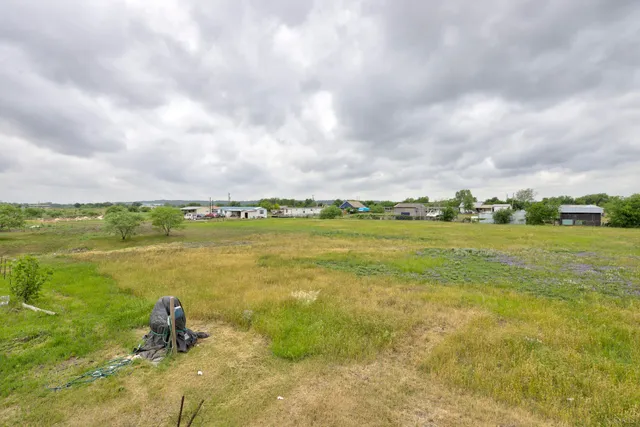a small garden in the backyard of a house