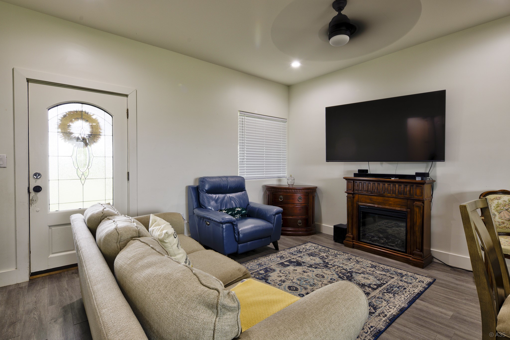 135 Wilbarger Bend Road Bastrop, TX 78602 - Photo 8 of 39 a living room with furniture a flat screen tv and a fireplace