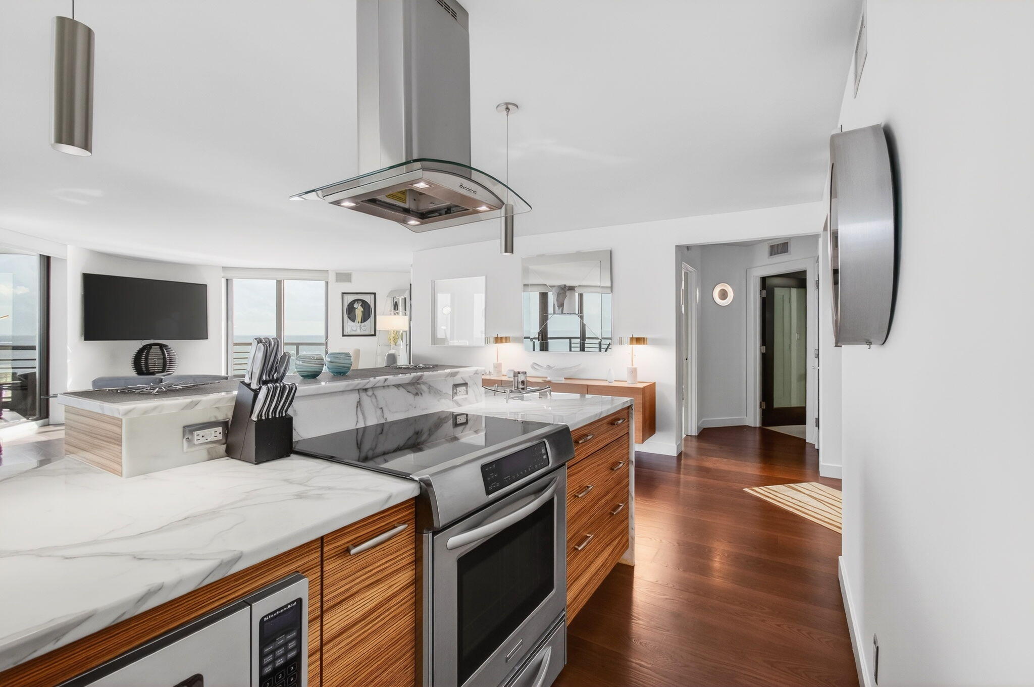 250 South Ocean Boulevard, Unit LPHA Boca Raton, FL 33432 - Photo 12 of 108 a kitchen with stainless steel appliances granite countertop a sink and a refrigerator