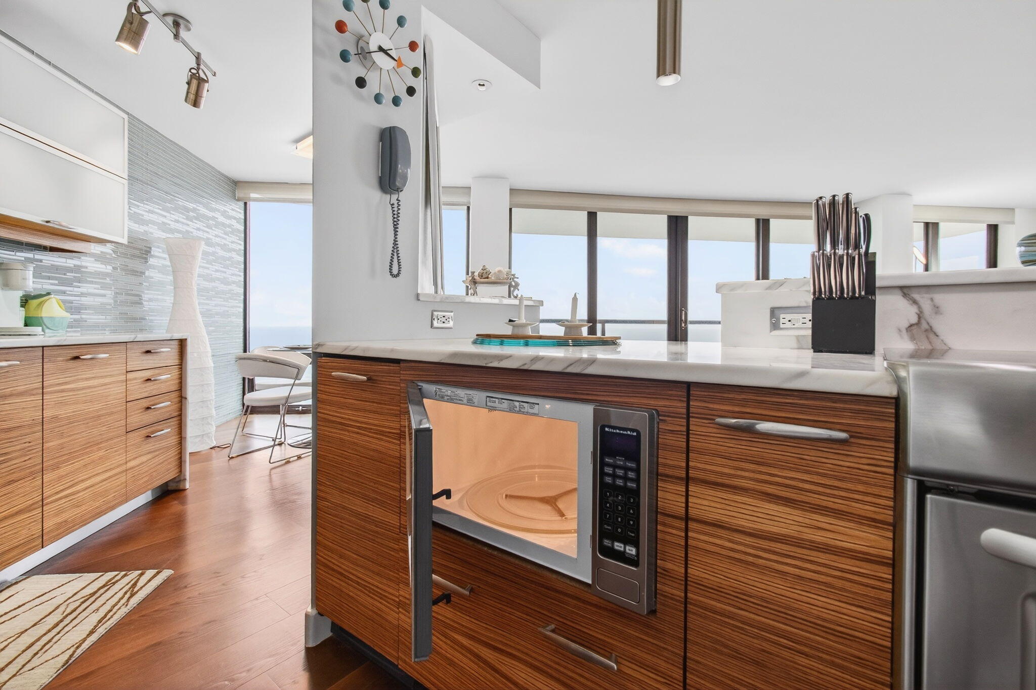 250 South Ocean Boulevard, Unit LPHA Boca Raton, FL 33432 - Photo 17 of 108 a kitchen with stainless steel appliances granite countertop a sink stove and cabinets