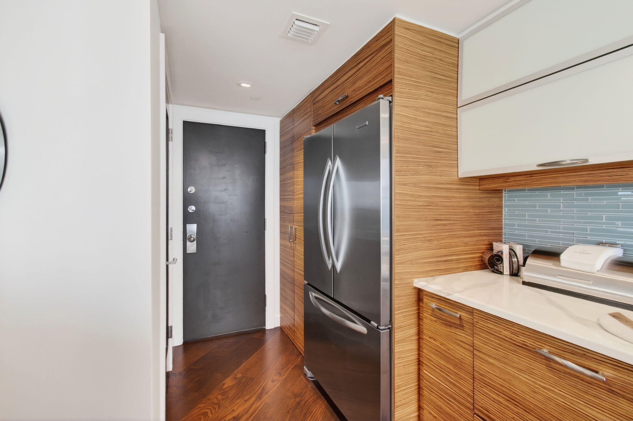 250 South Ocean Boulevard, Unit LPHA Boca Raton, FL 33432 - Photo 18 of 108 a kitchen with a refrigerator and a sink