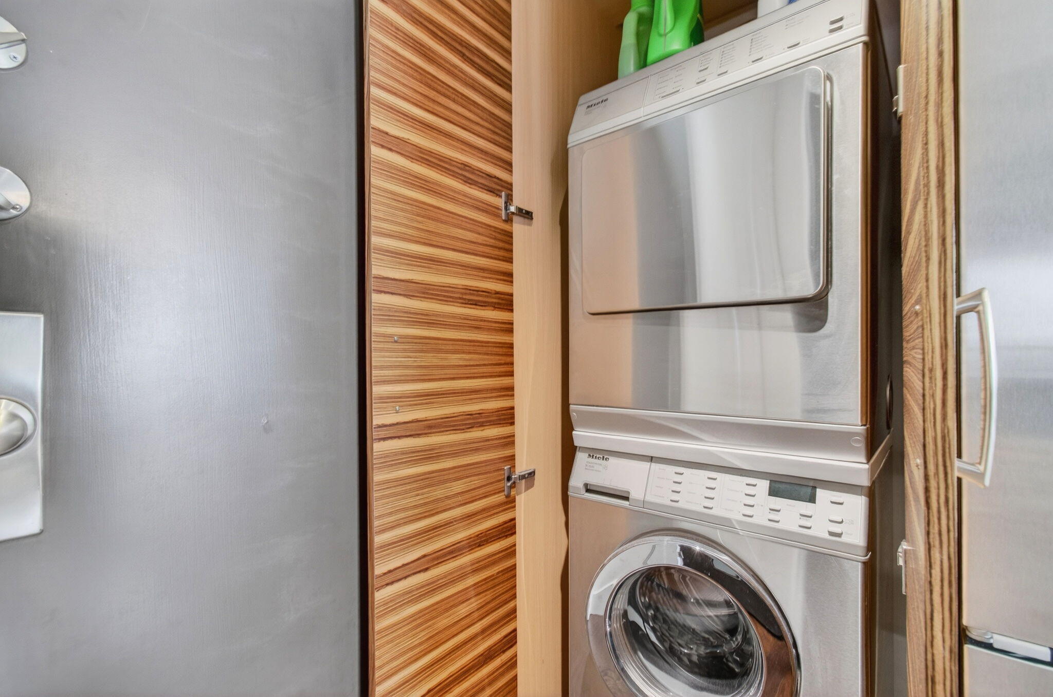 250 South Ocean Boulevard, Unit LPHA Boca Raton, FL 33432 - Photo 19 of 108 a view of a kitchen with washer and dryer