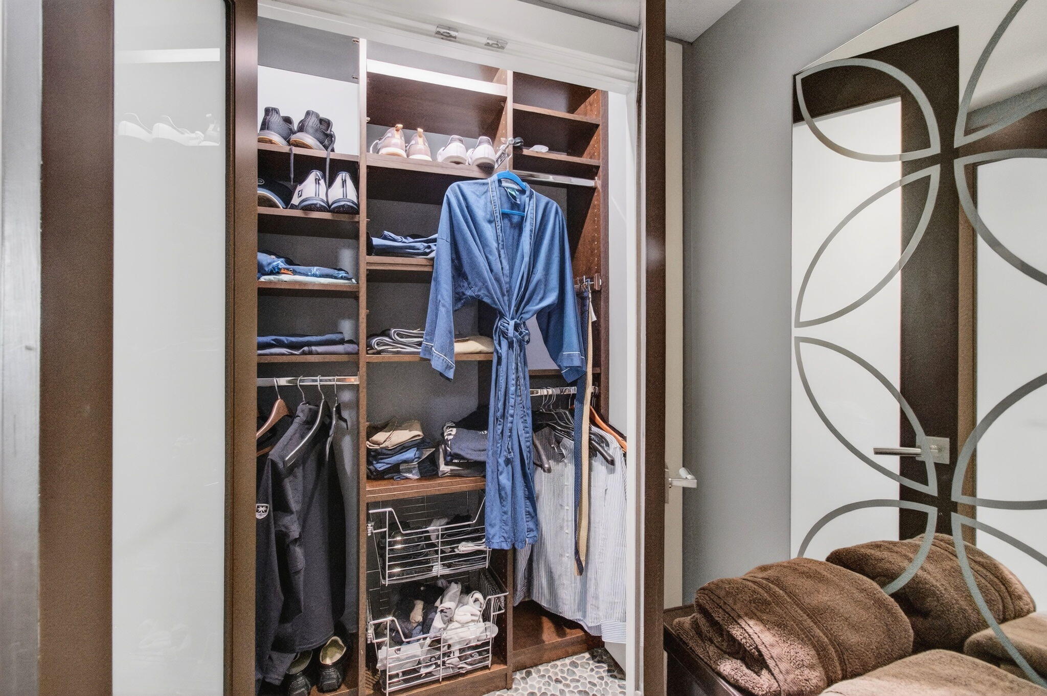 250 South Ocean Boulevard, Unit LPHA Boca Raton, FL 33432 - Photo 40 of 108 a view of walk in closet with clothes and shoes