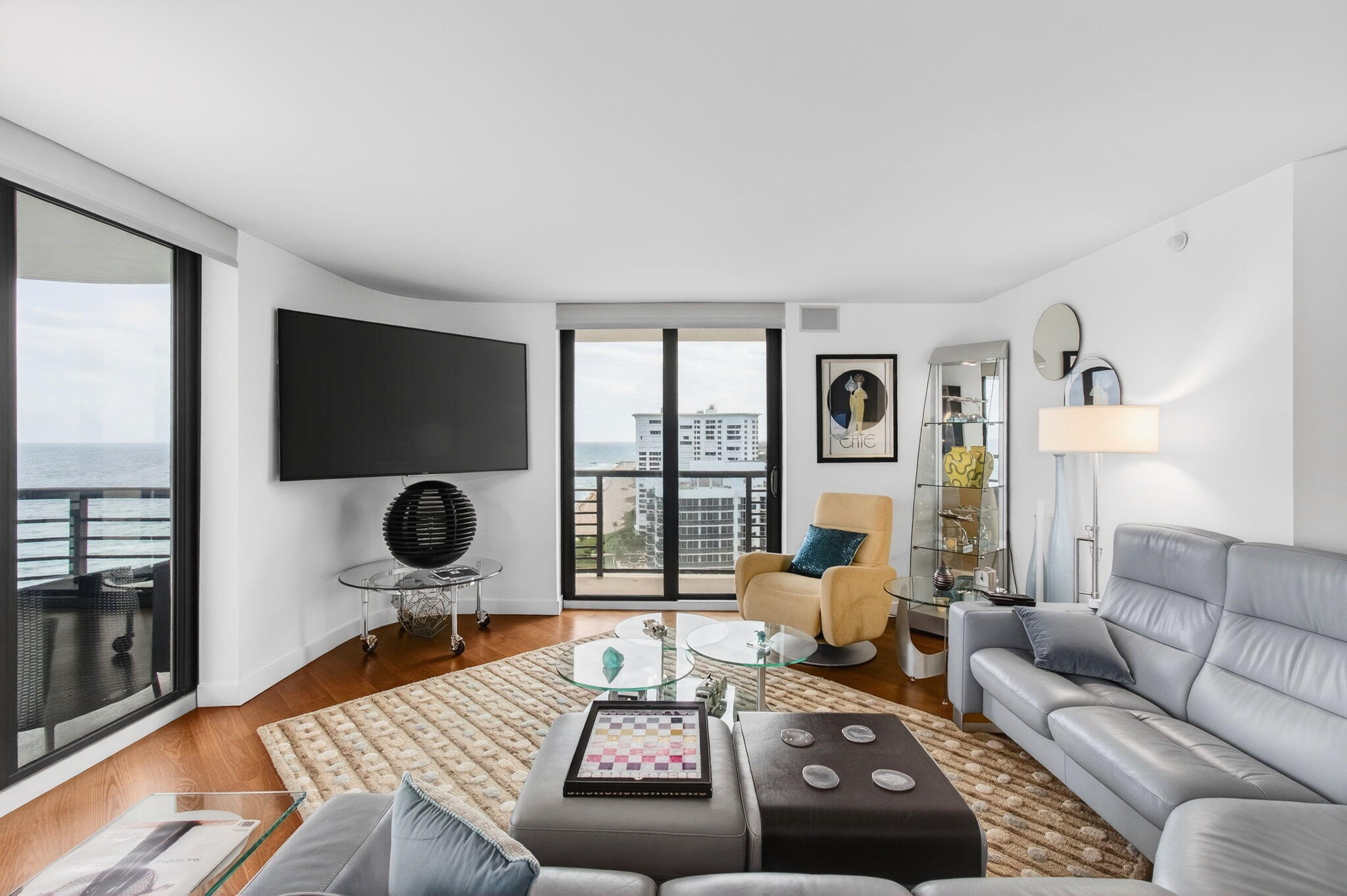 250 South Ocean Boulevard, Unit LPHA Boca Raton, FL 33432 - Photo 6 of 108 a living room with furniture and a flat screen tv