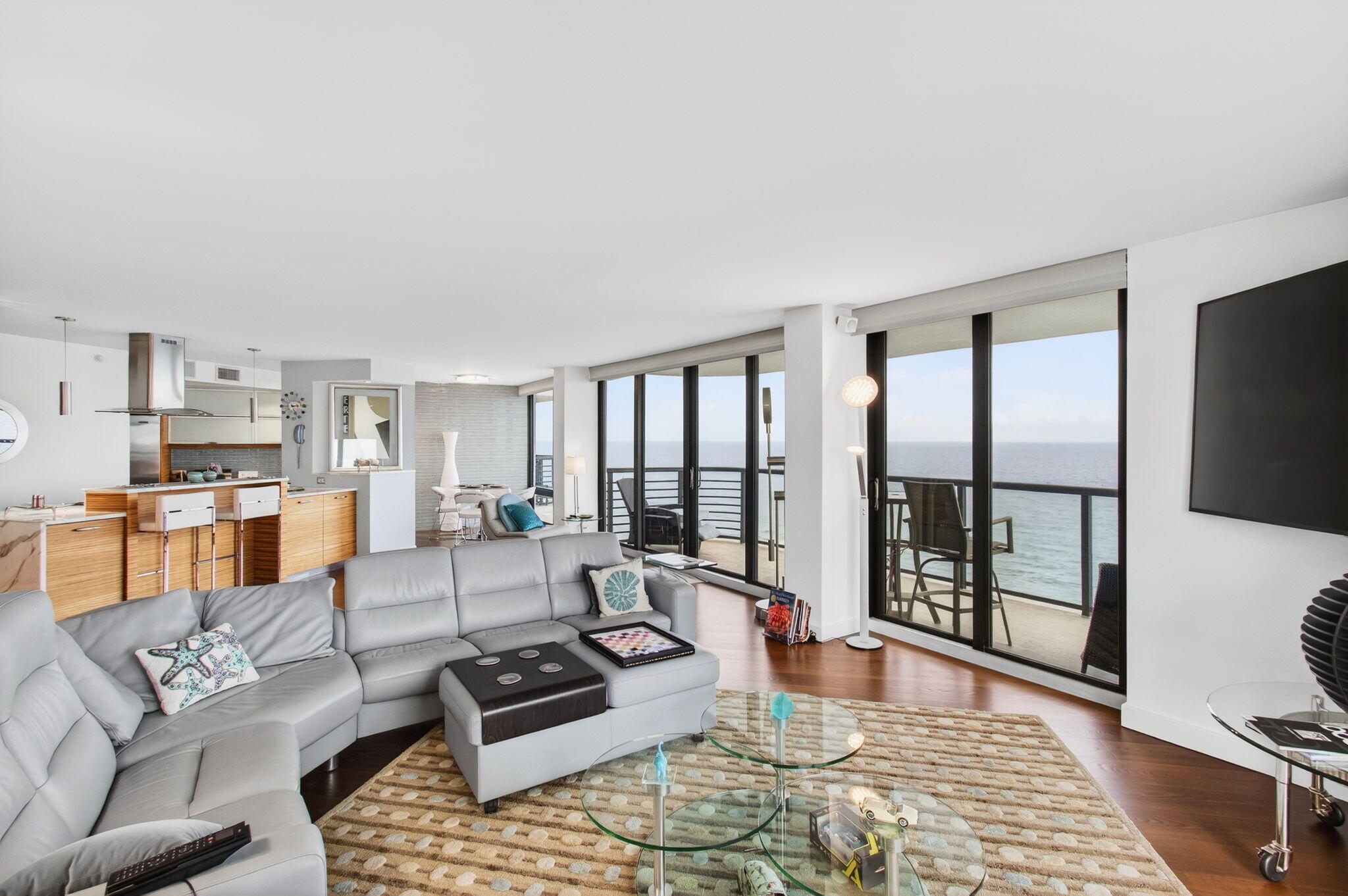 250 South Ocean Boulevard, Unit LPHA Boca Raton, FL 33432 - Photo 8 of 108 a living room with furniture and a flat screen tv