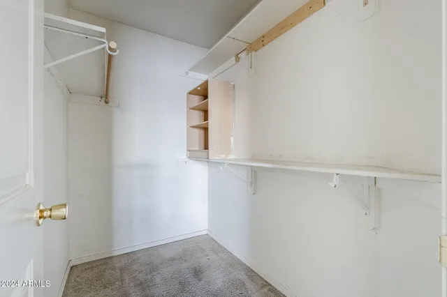 a view of walk in closet with window