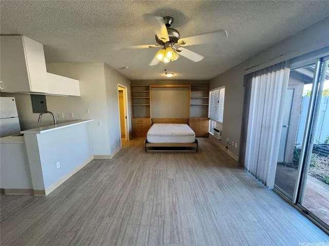 a room with a bed and a chandelier