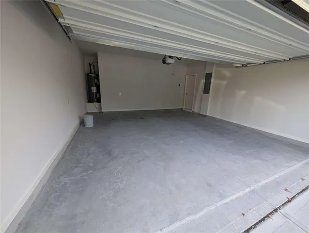 a kitchen with kitchen island granite countertop a sink a stove and refrigerator