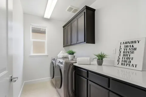 a utility room with window washer and dryer