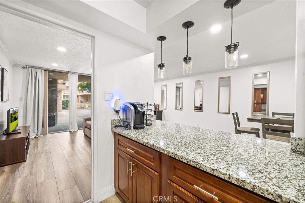 6979 Palm Court, Unit 104A Riverside, CA 92506 - Photo 20 of 53 a view of living room with granite countertop living room couch and furniture