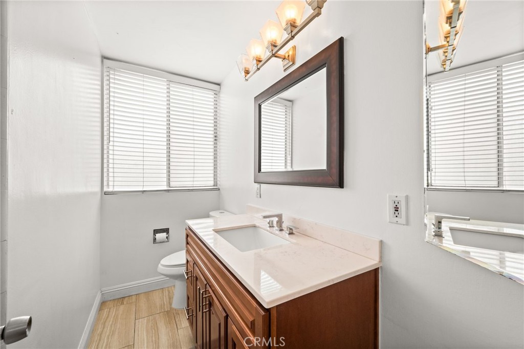 6979 Palm Court, Unit 104A Riverside, CA 92506 - Photo 33 of 53 a bathroom with a sink and a vanity