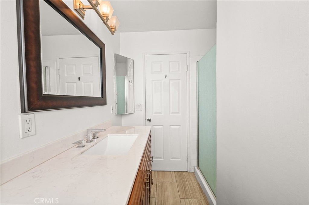 6979 Palm Court, Unit 104A Riverside, CA 92506 - Photo 34 of 53 a bathroom with a sink and a mirror