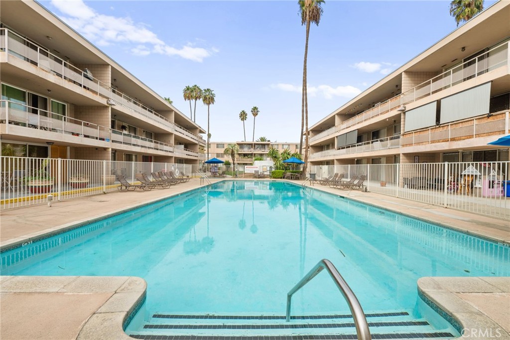 6979 Palm Court, Unit 104A Riverside, CA 92506 - Photo 42 of 53 a view of a swimming pool with a yard