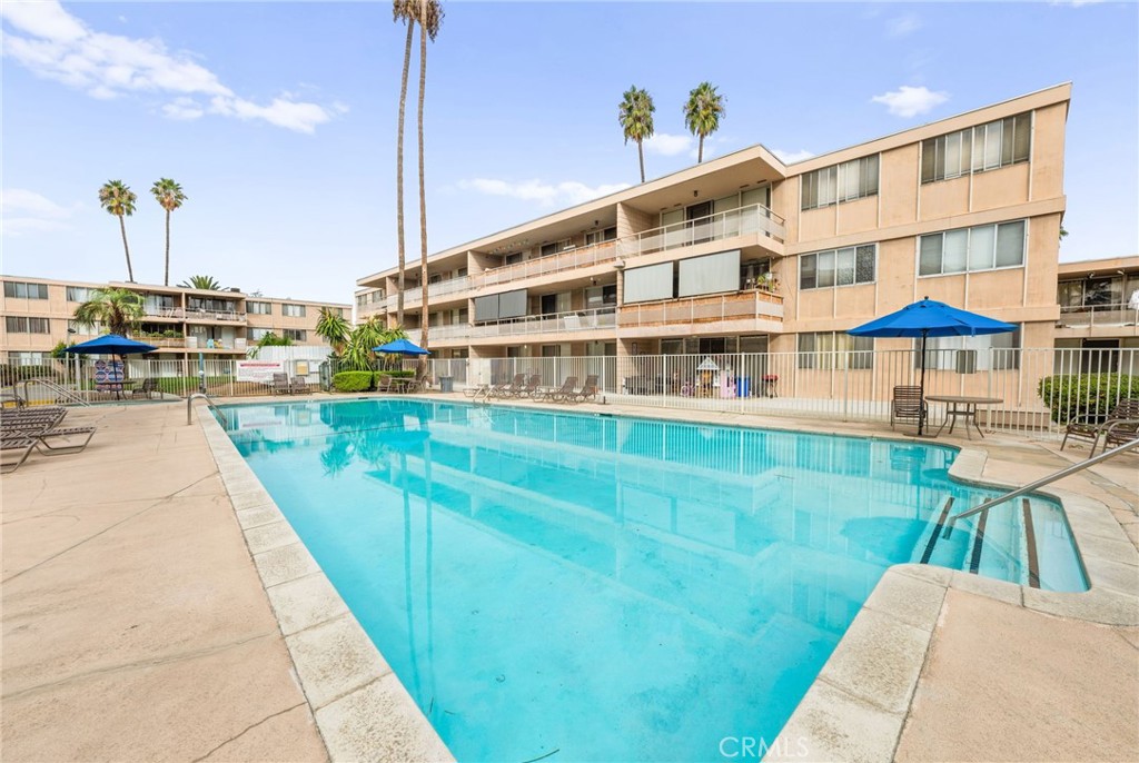 6979 Palm Court, Unit 104A Riverside, CA 92506 - Photo 43 of 53 a view of building with outdoor space and seating area