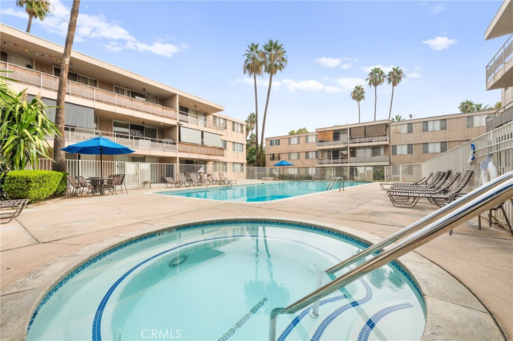6979 Palm Court, Unit 104A Riverside, CA 92506 - Photo 44 of 53 a swimming pool with outdoor seating and yard