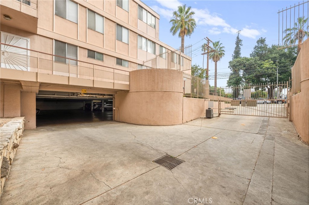 6979 Palm Court, Unit 104A Riverside, CA 92506 - Photo 45 of 53 a backyard of a building with barbeque oven and outdoor seating