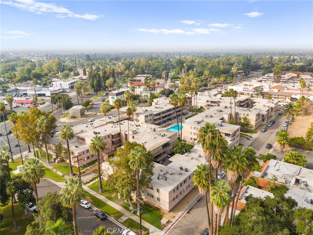 6979 Palm Court, Unit 104A Riverside, CA 92506 - Photo 51 of 53 an aerial view of residential building with parking space