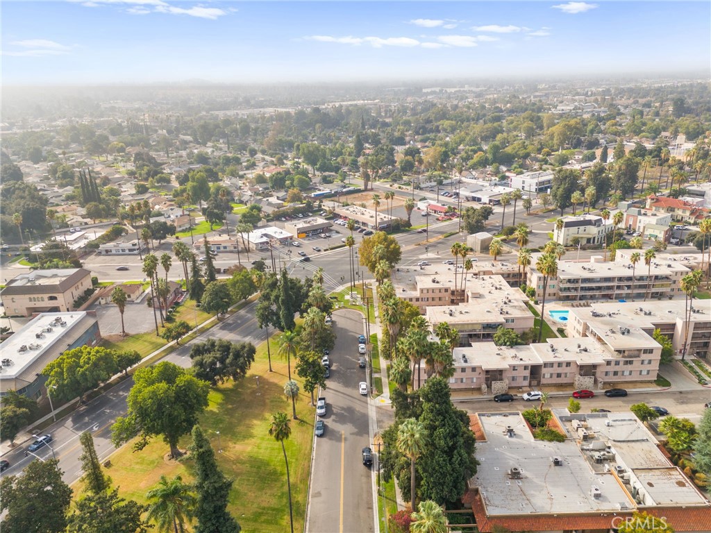 6979 Palm Court, Unit 104A Riverside, CA 92506 - Photo 52 of 53 an aerial view of residential building with parking