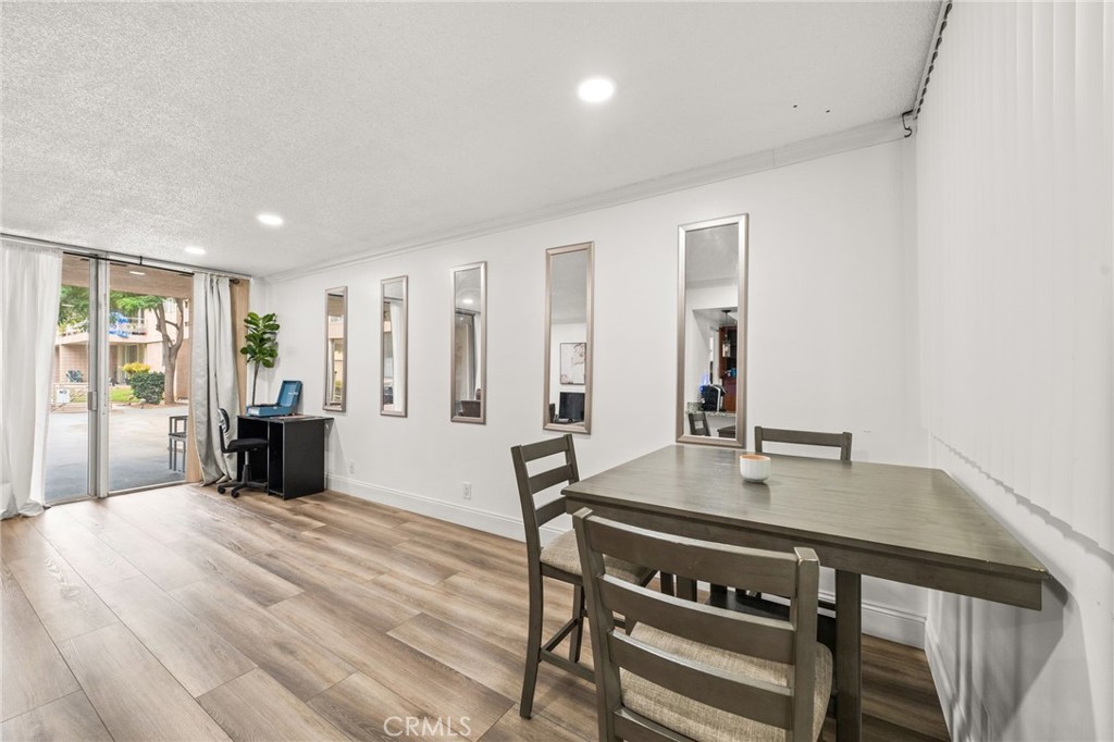 6979 Palm Court, Unit 104A Riverside, CA 92506 - Photo 9 of 53 a view of a room with furniture and wooden floor