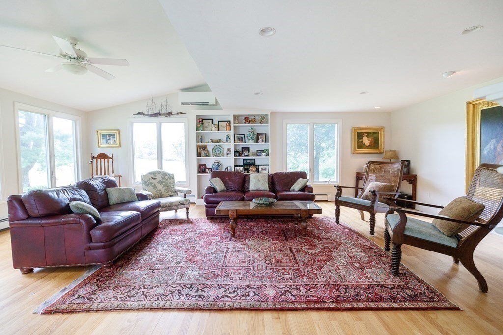 139 Fruit Street Hopkinton, MA 01748 - Photo 12 of 41 a living room with furniture a rug and a window