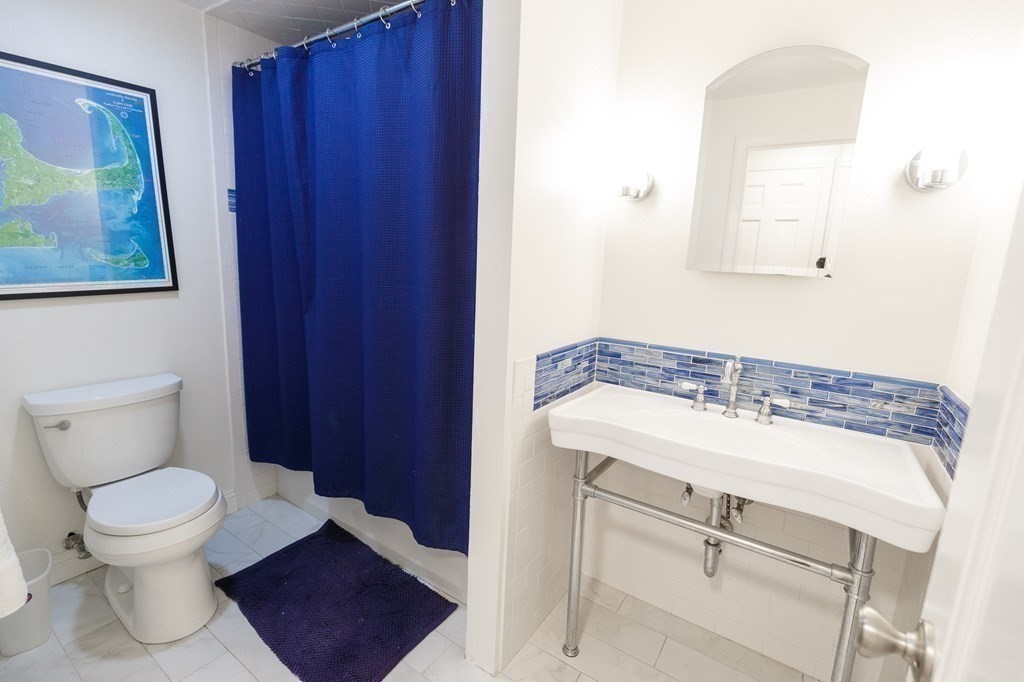 139 Fruit Street Hopkinton, MA 01748 - Photo 19 of 41 a bathroom with a toilet and a sink