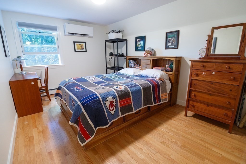 139 Fruit Street Hopkinton, MA 01748 - Photo 20 of 41 a bed room with a bed and a dresser