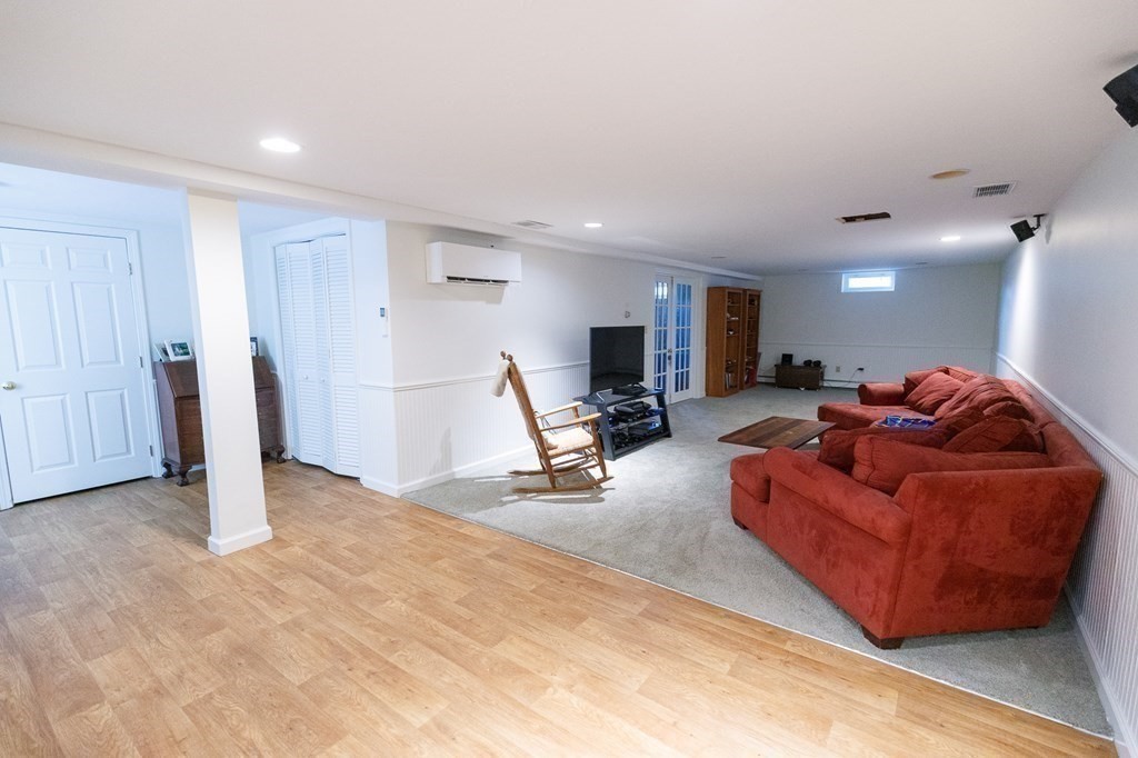 139 Fruit Street Hopkinton, MA 01748 - Photo 22 of 41 a living room with furniture and a table