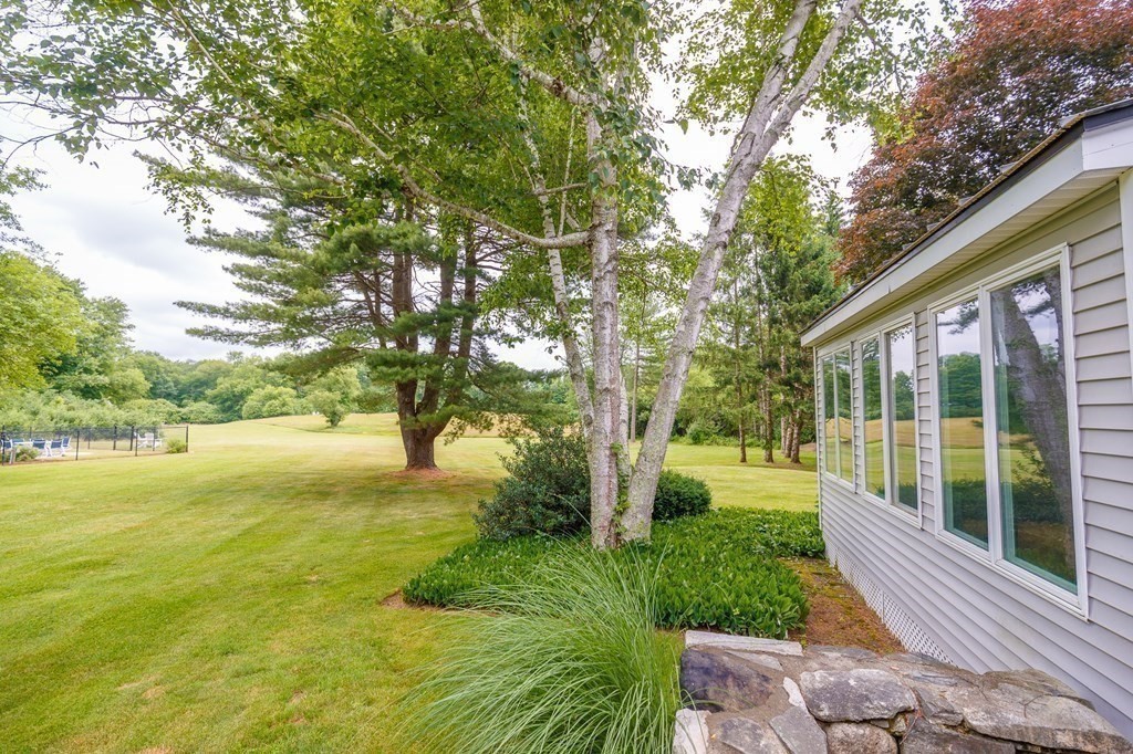 139 Fruit Street Hopkinton, MA 01748 - Photo 25 of 41 a view of a house with a backyard