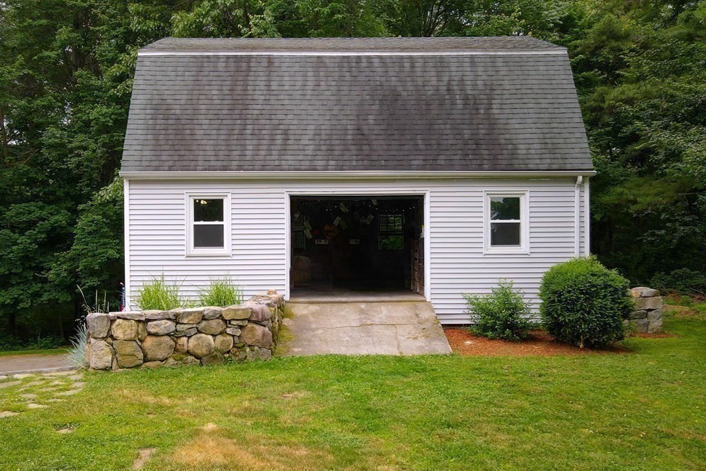 139 Fruit Street Hopkinton, MA 01748 - Photo 26 of 41 a backyard of a house with table and chairs