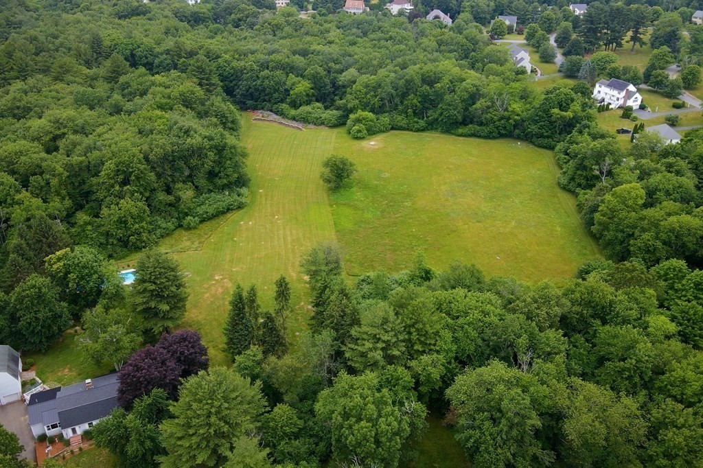 139 Fruit Street Hopkinton, MA 01748 - Photo 3 of 41 an aerial view of residential houses with outdoor space and trees all around