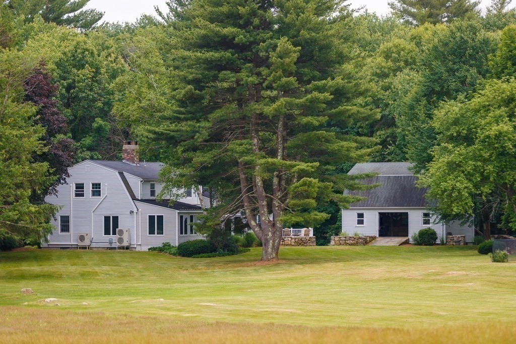 139 Fruit Street Hopkinton, MA 01748 - Photo 32 of 41 a aerial view of a house with swimming pool and large trees