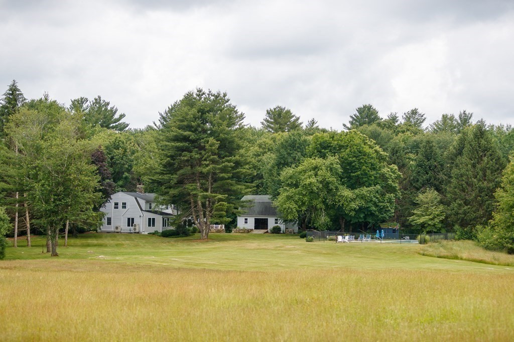 139 Fruit Street Hopkinton, MA 01748 - Photo 33 of 41 a view of a swimming pool with an outdoor space and seating area