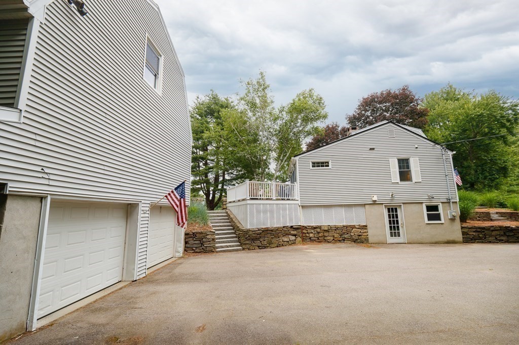 139 Fruit Street Hopkinton, MA 01748 - Photo 5 of 41 a view of a house with a outdoor space