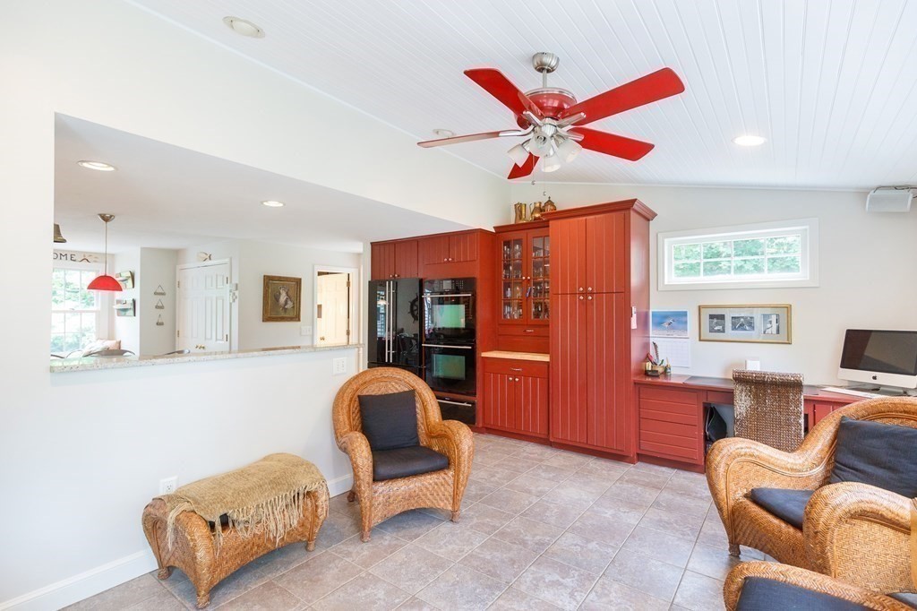 139 Fruit Street Hopkinton, MA 01748 - Photo 7 of 41 a living room with furniture a ceiling fan and a window