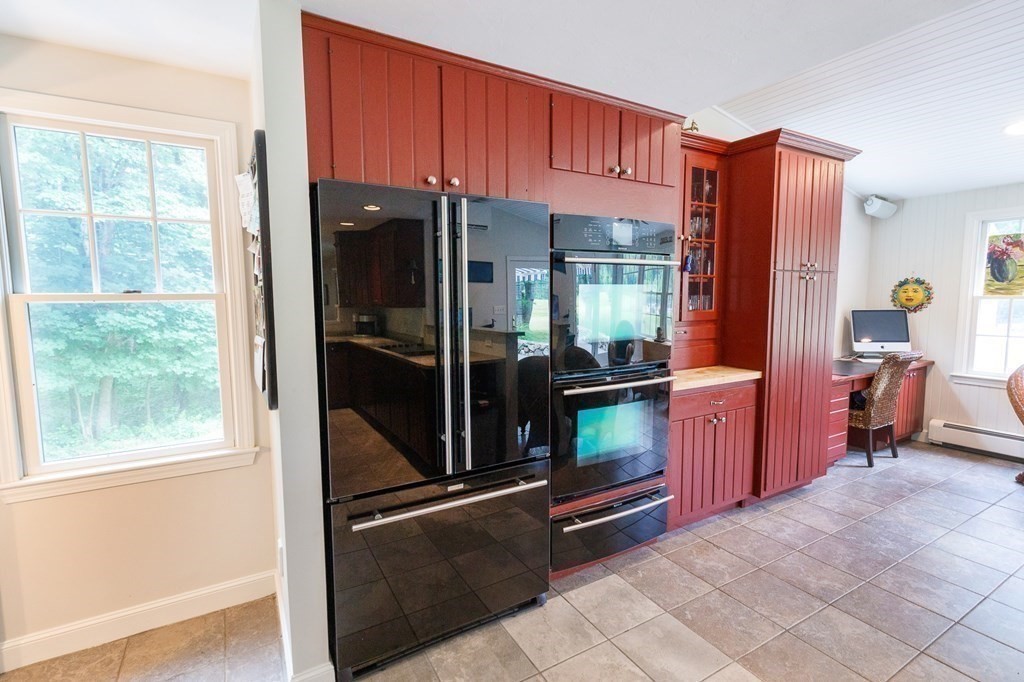 139 Fruit Street Hopkinton, MA 01748 - Photo 9 of 41 a kitchen with stainless steel appliances granite countertop a refrigerator and a sink