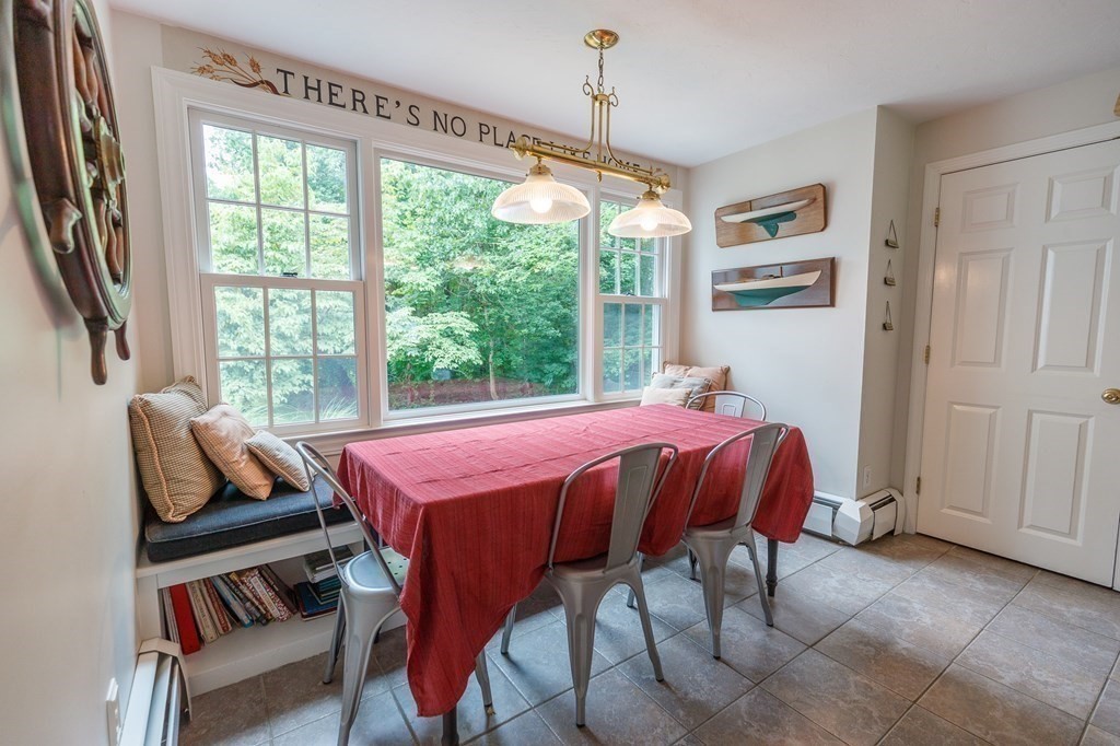 139 Fruit Street Hopkinton, MA 01748 - Photo 10 of 41 a bed sitting in a bedroom next to a window