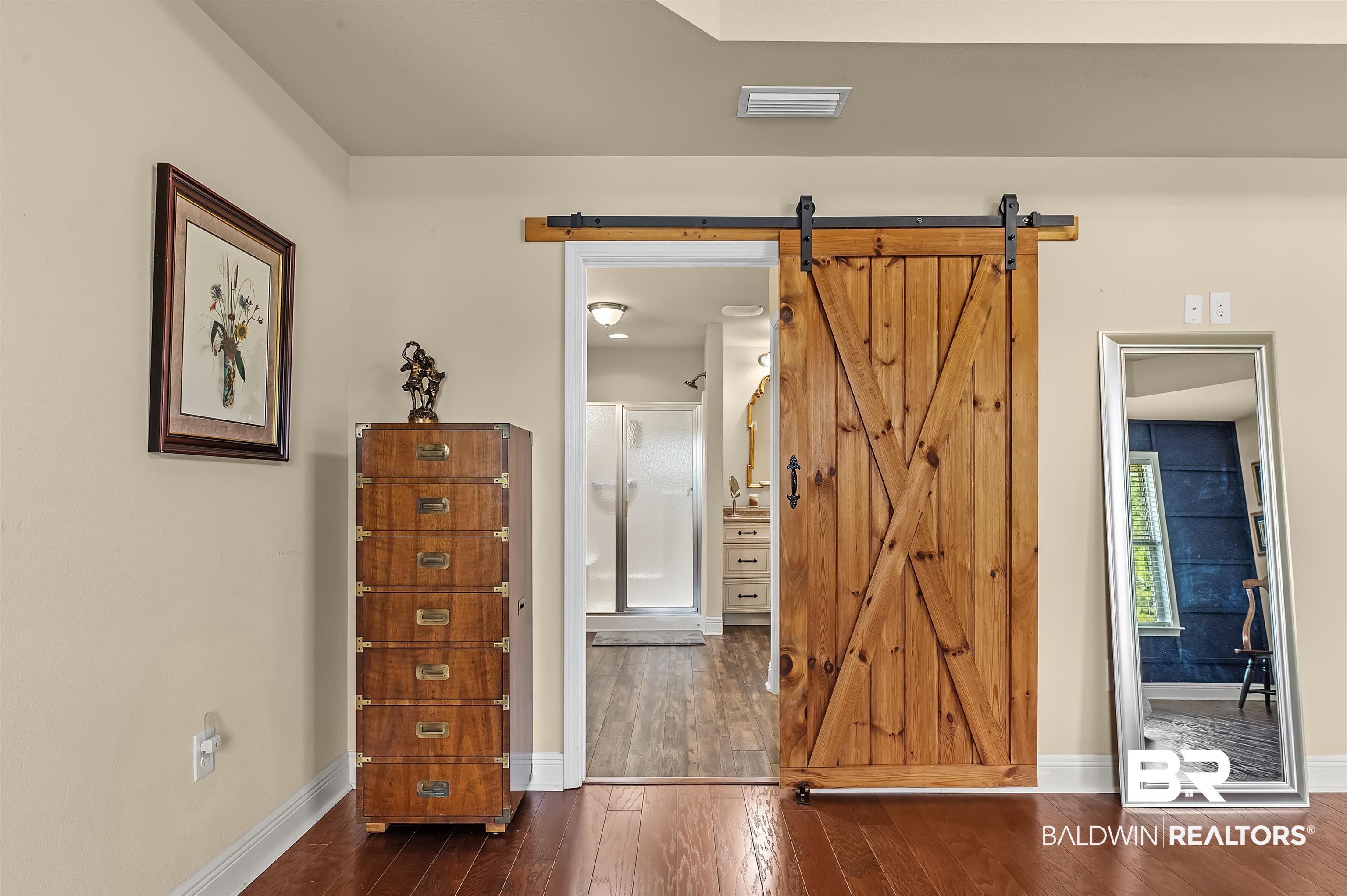 8896 Allay Lane Foley, AL 36535 - Photo 43 of 57 Interior space featuring dark hardwood / wood-style flooring and a barn door
